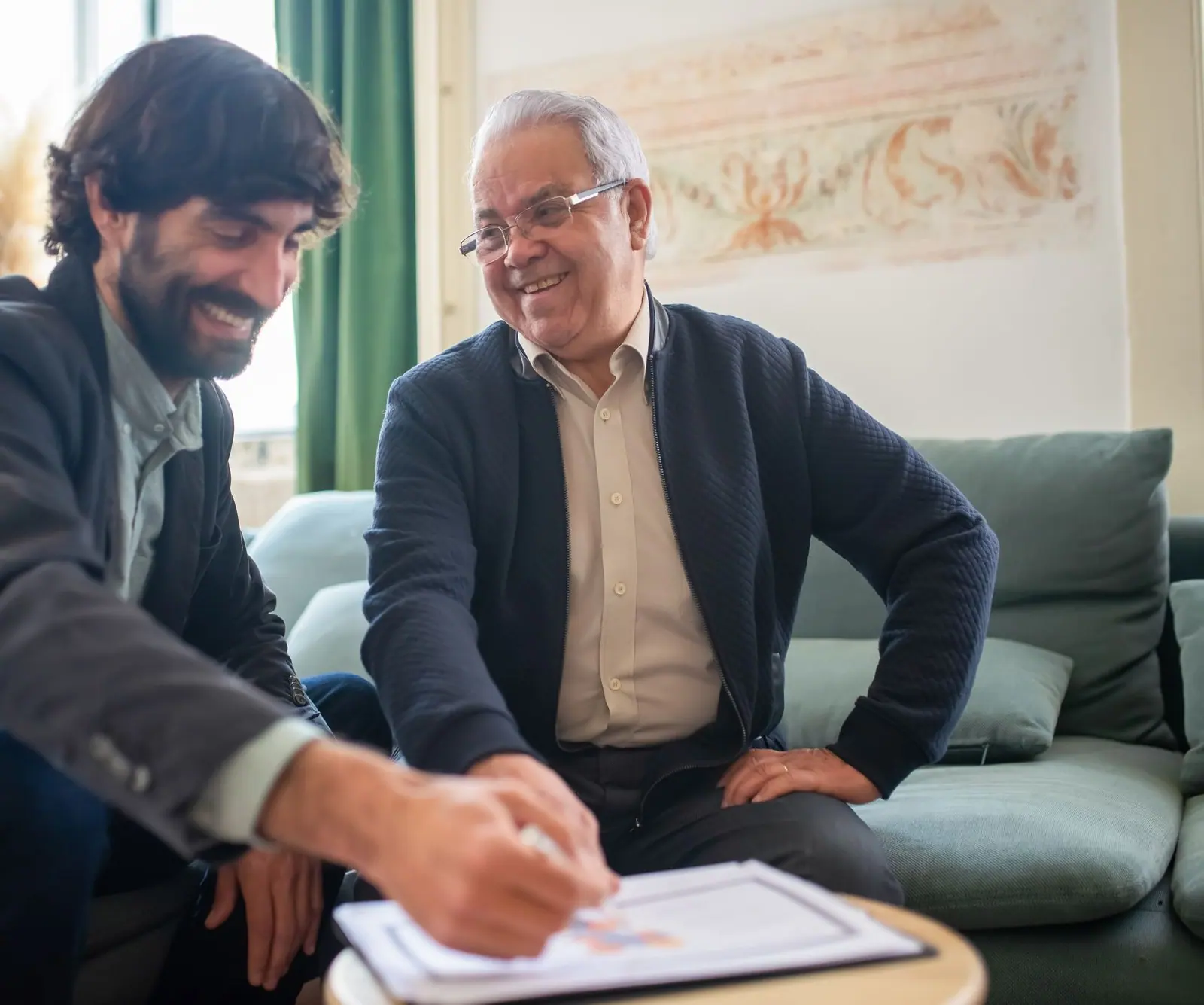 An advisor going through a plan with a client across a table