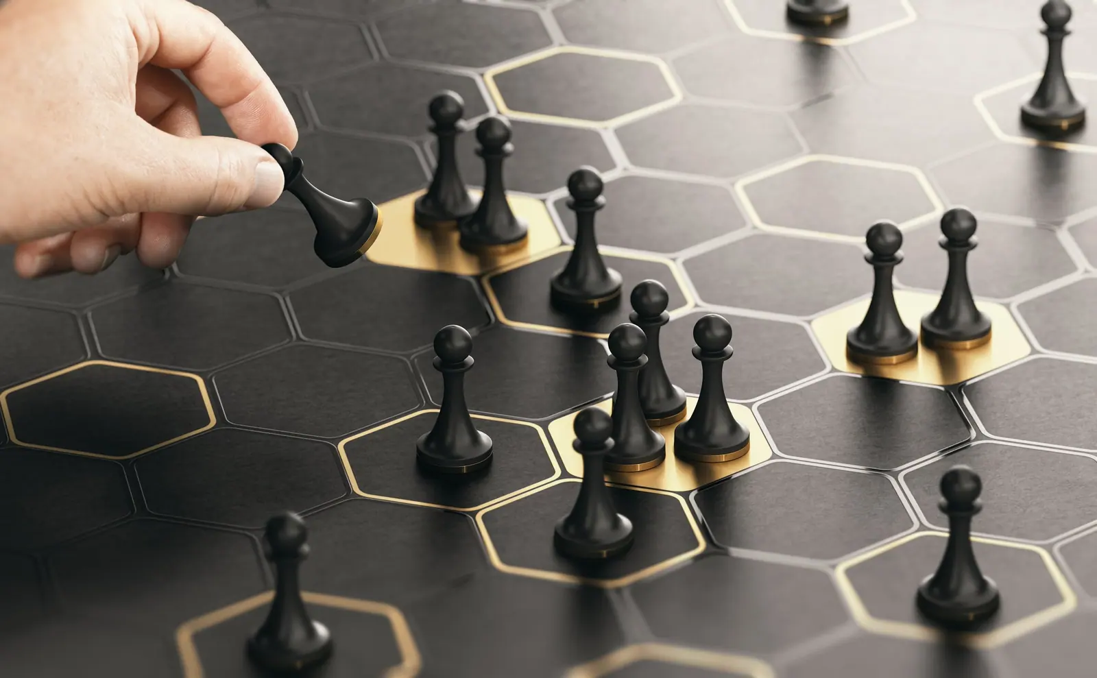 A hand moving a chess piece across a strategy board